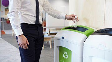 Recycling services — a plastic bottle going into a bin in Taylors, SC